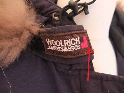 logotipo falso de la etiqueta woolrich 